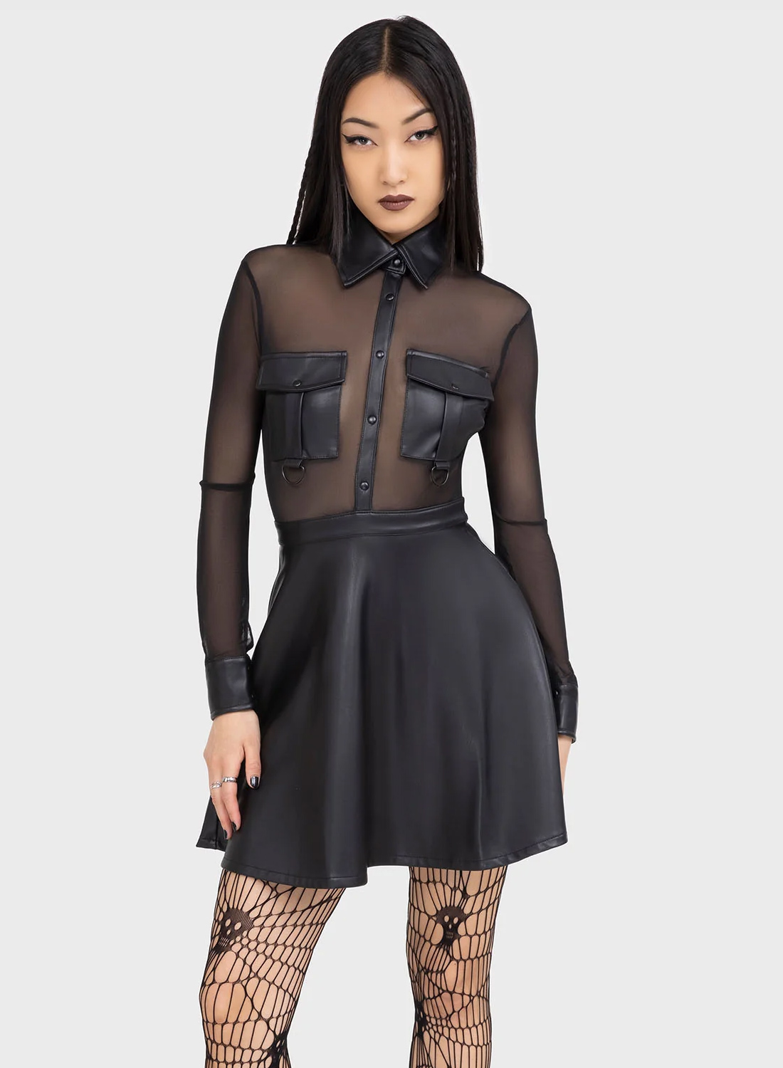 Killstar Shadowsinger Dress. Svart mini klänning med transparent mesh överdel och PU kjol, lång ärm och knappdetaljer från Killstar.