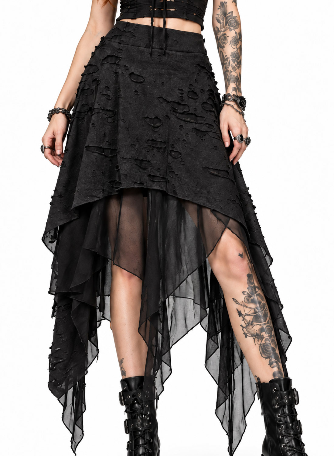 Apocalypse Chic Skirt, svart gotisk asymmetrisk kjol med strukturerat, slitet tyg, transparenta meshlager, spetsiga fållar och elastisk midja.